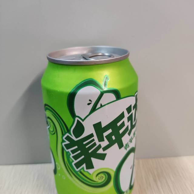 美年达可乐mirinda青苹果味汽水碳酸饮料330ml24罐整箱装新老包装随机